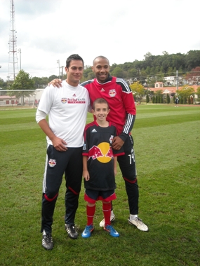 Mike Petke, assistant coach, the New York Red Bulls; wish kid Tyler and Thierry Henry from the New York Red Bulls.