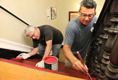 Company sends volunteers to spruce up Poppenhusen Institute