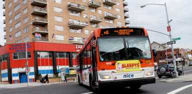 Queens woman dies after bus strikes her