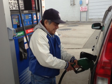 Francisco Alonzo,68, fills his car up at the Mobil on 164th Street in Jamaica.
