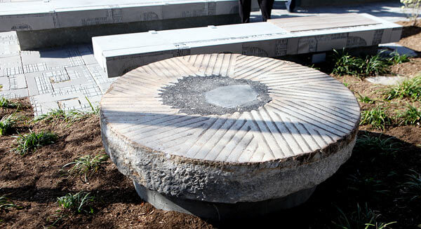 LIC millstone damaged in Queens Plaza setting