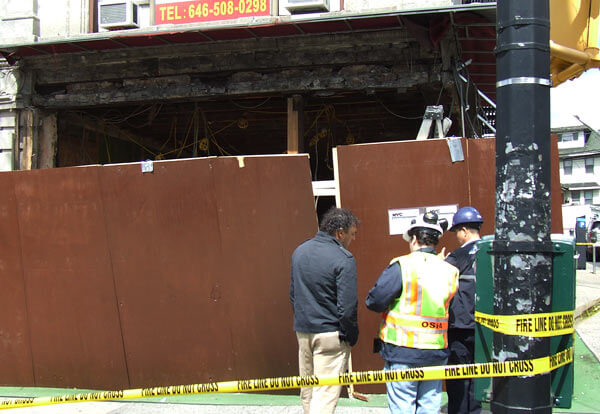Building facade in Astoria partially collapses, injuring worker