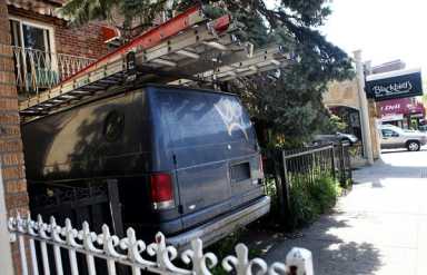 Dead man found under van in Astoria