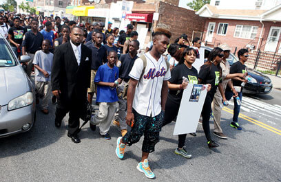 Mourners march for D’aja, 14