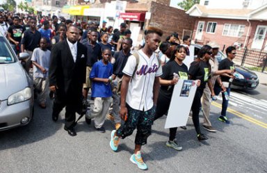 Mourners march for D’aja, 14