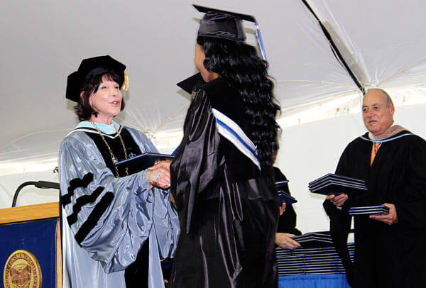 QCC gets new prez at 2013 graduation