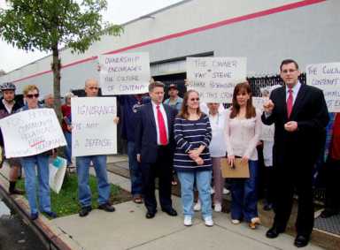Neighbors target car dealer