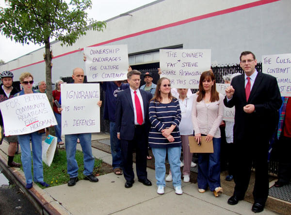 Neighbors target car dealer