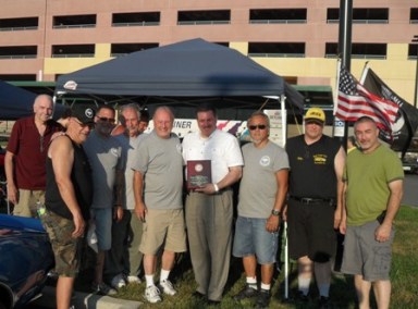 The East Coast Car Association gave State Senator Joseph Addabbo a plaque of appreciation after he helped the group find a new home for the association’s Cruise Night.