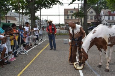 Cowboy Curly Hall performed rope tricks and explained the history of the cowboys to children at the ninth annual Jump and Ball Tournament.