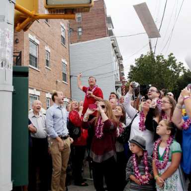 Queens basketball coach receives street co-naming