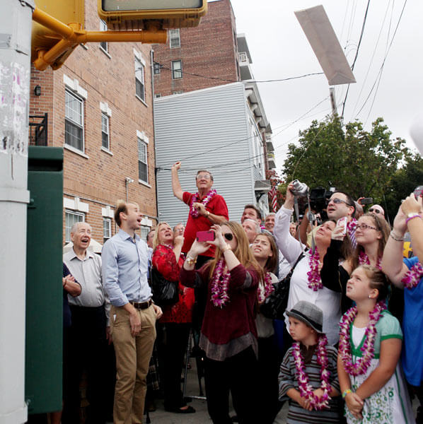 Queens basketball coach receives street co-naming