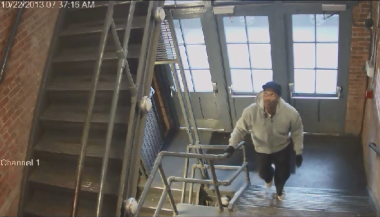 A screenshot of warehouse surveillance video show the burglary suspect wanted by police.