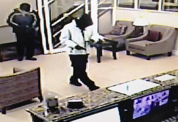 Police look for Ozone Park hotel robbers