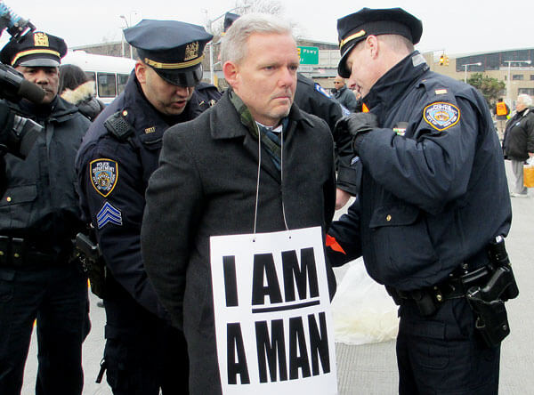 Elected officials and workers protest at LaGuardia Airport with civil disobedience