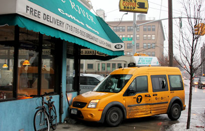 Taxi ends up colliding with coffee shop wall in LIC accident