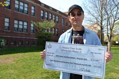 Michael Feiner with check