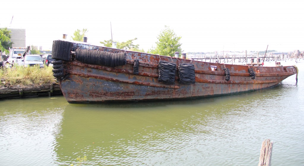 An abandoned boat sits in Flushing Bay Harbor in College Point