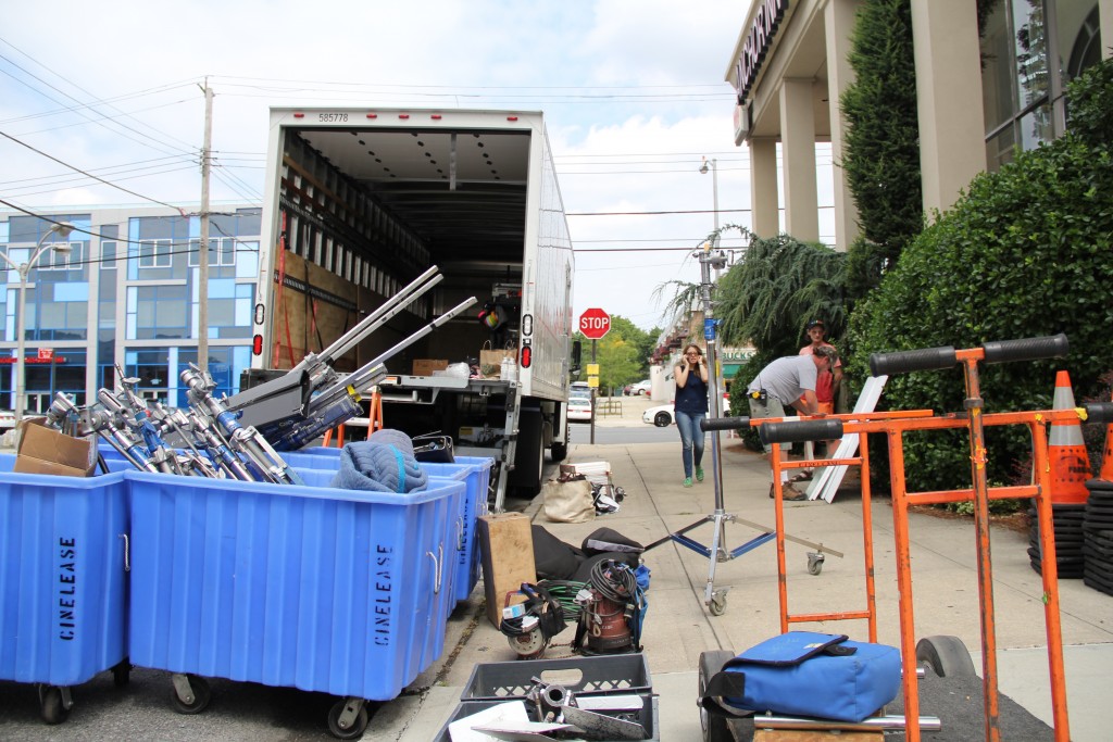 Film crew members work to set the scene for the new movie "Louder Than Bombs.