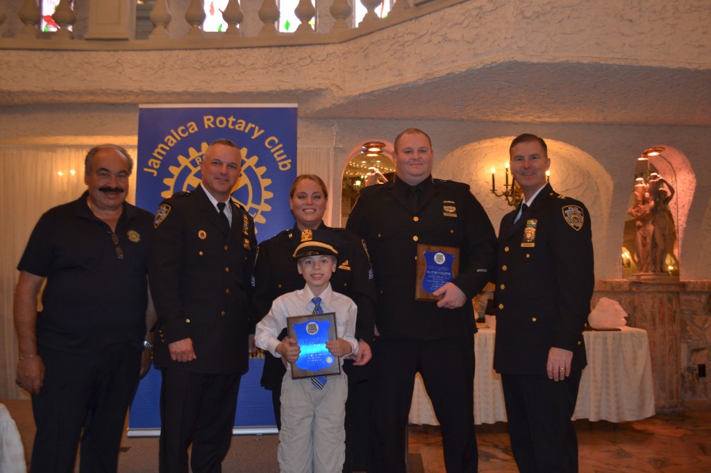 Sgt. Mary Humburg and P.O. Steven Perretta from the 103th Precinct were honored for their outstanding work of arresting a criminal with a semi-automatic handgun back in August. (From left: Joe Iaboni, Deputy Inspector John Capplemann, Sgt. Mary Humburg, her son, P.O. Steven Perretta and Commanding Officer of Queens South, David Barrere)