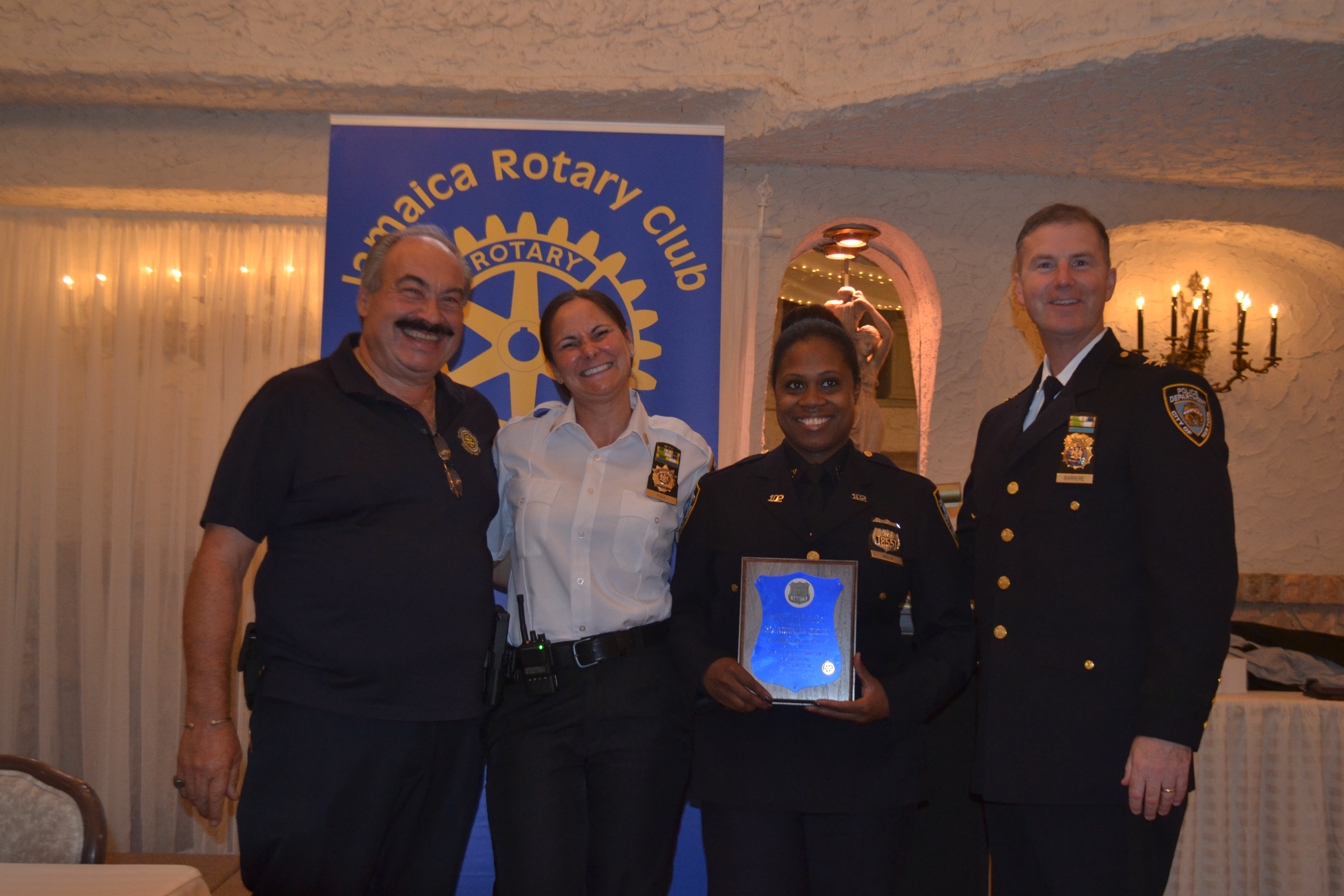P.O. Ashana Kelly from the 102nd Precinct was honored for her role in catching a repeat robbery offender. (From left: Joe Iaboni, Executive Officer Danielle Reyes, P.O. Ashana Kelly and Commanding Officer of Queens South David Barrere)