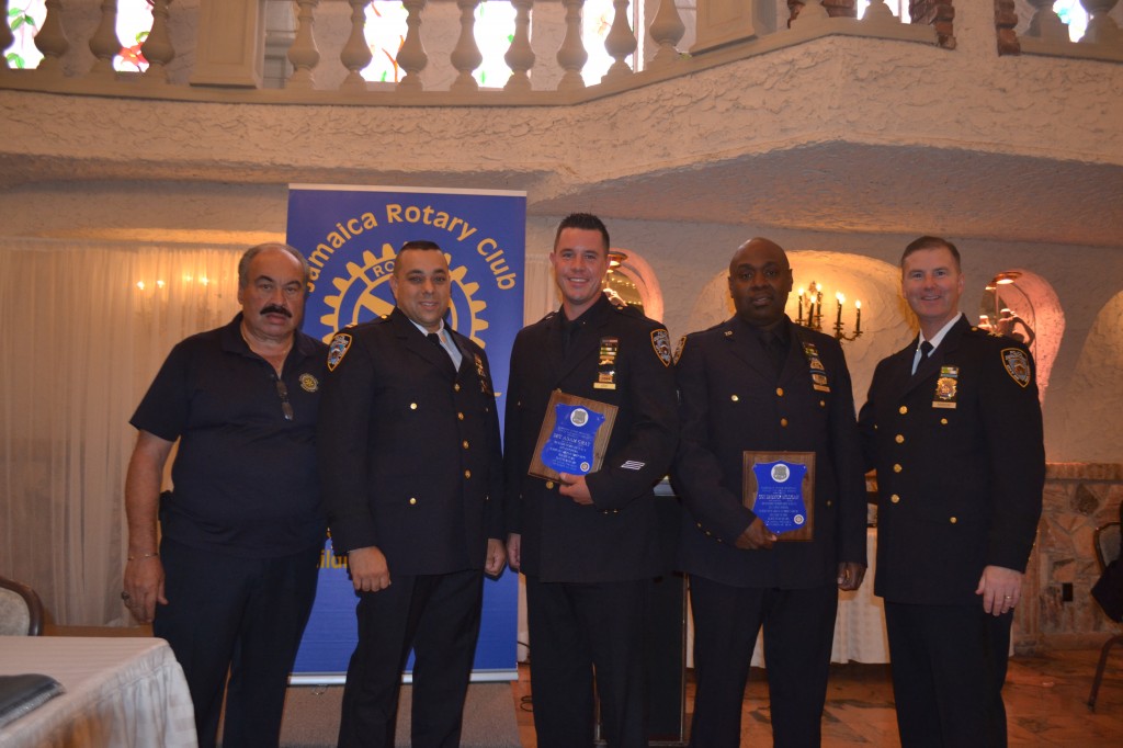 Detective Adam Gray and Sgt. Derrick Milligan were honored for their work in a robbery in progress where they arrest the criminal and secured a  25 automatic firearm. (From left: Joe Iaboni, Executive Officer Rod Dantini, Detective Adam Gray, Sgt. Derrick Milligan and Commanding Officer of Queens south, David Barrere)