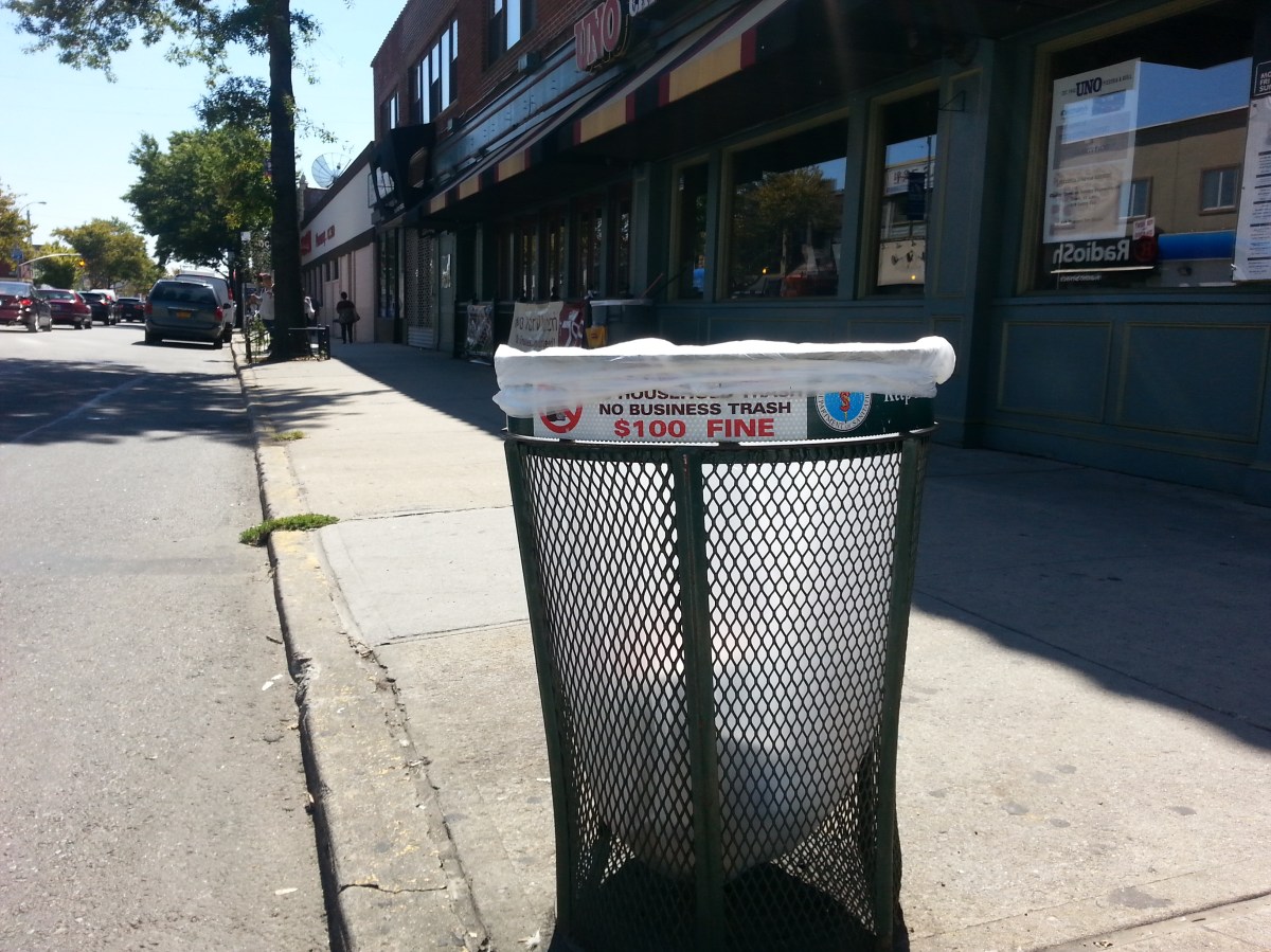 Trash can liners, like this one on Bell Boulevard, will be replaced by The Doe Fund cleanup crew.