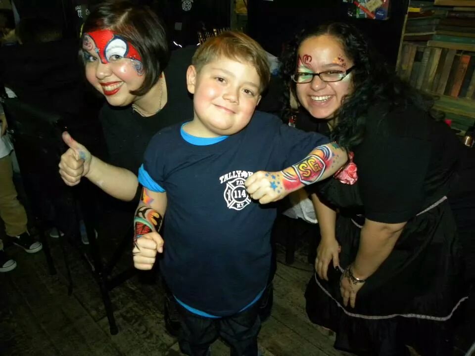 Gabriel Santini Naughton with Lenore Koppelman (left) and her assistant from The Cheeky Chipmunk, who donated their time during a fundraiser for the 6-year-old.