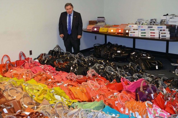 Richard-Brown-with-seized-counterfeit-items-624×572