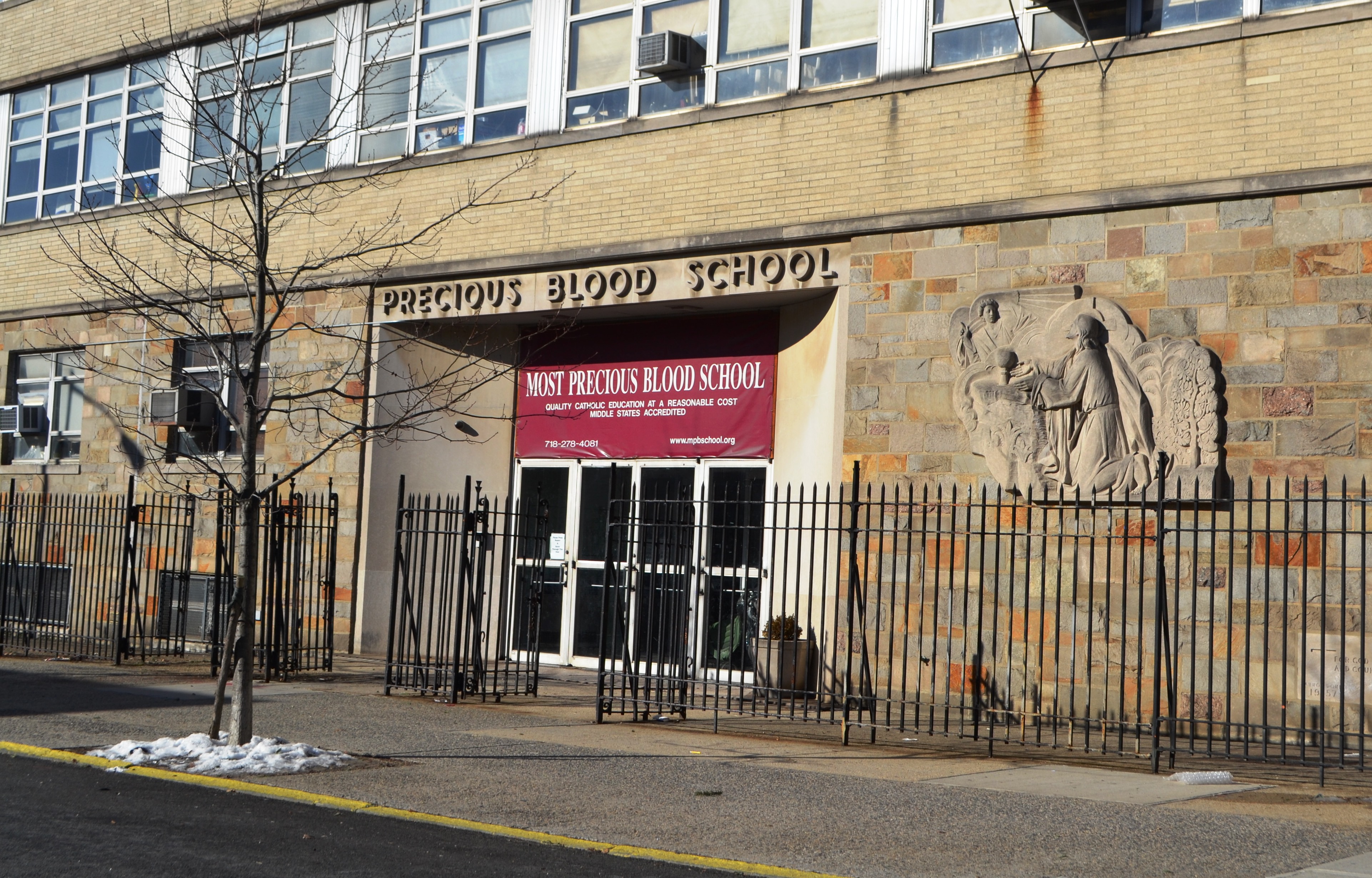 Community rallies to stop closing of Astoria Catholic school
