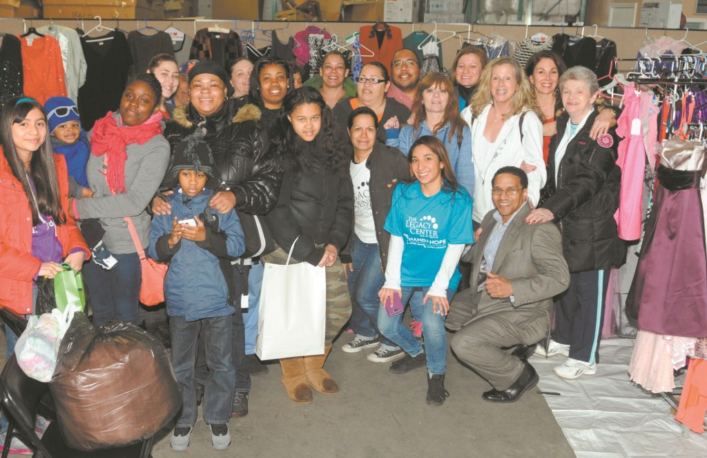 Students and parents picking up their free dresses at last year's PROMises prom dress drive.