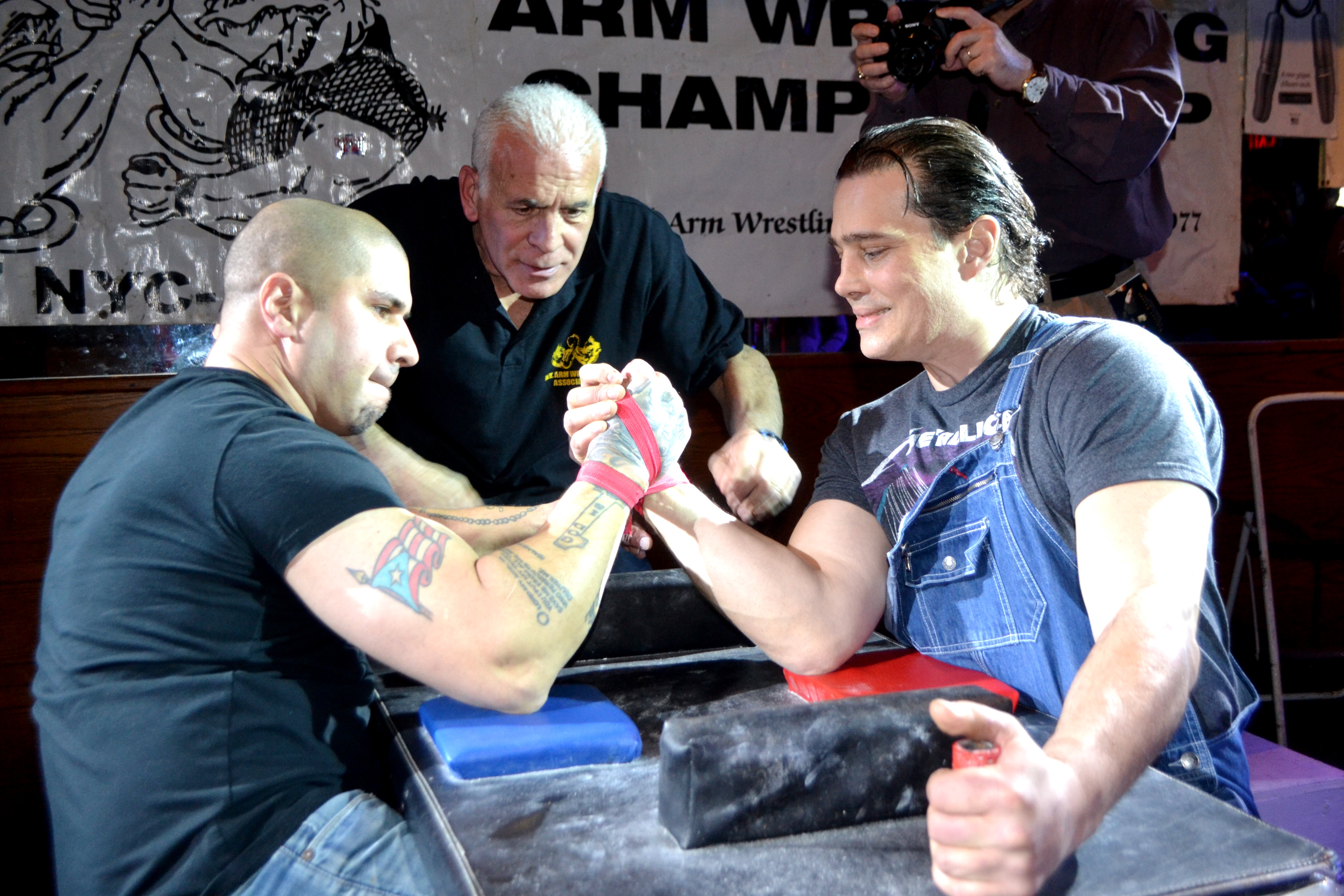 Angel Cosme (left) and Jason Vale (right) took home top prizes at the NYC Sit-Down Arm Wrestling Championships.