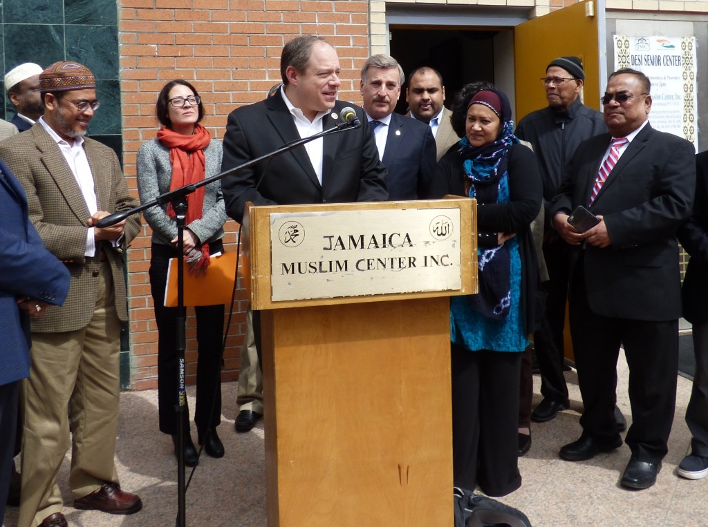 Councilman Rory Lancman is flanked by members of the Jamaica Muslim Center during the unveiling of a converted one-way street.