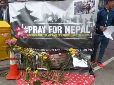Close to a thousand people got together on Sunday for a candlelight vigil for the victims of the earthquake in Nepal.