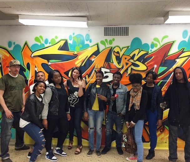 5Pointz curator Jonathan Cohen (far right) finished his first wall at August Martin High School on May 3.