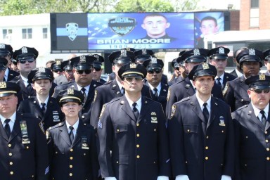 Thousands of members of the NYPD and police officers from across the country came to pay their respects to Police Officer Brian Moore.