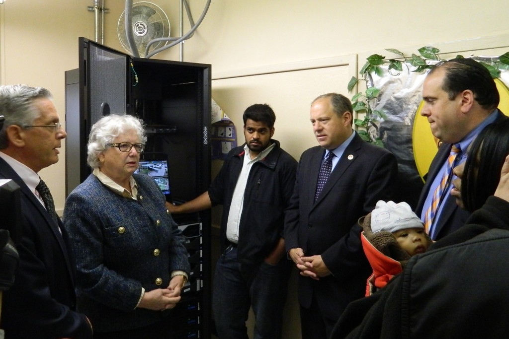 A NYCHA official and a technology specialist explain how footage from the outdoor cameras will be stored and used by law enforcement to Senator Toby Ann Stavisky, Council Member Rory Lancman, Assemblyman Michael Simanowitz and Pomonok Residents Association President Monica Corbett. (Photo courtesy of the office of Toby Ann Stavisky)