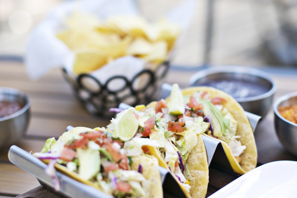 Baja Fish Tacos from Maya made with spicy beer-battered cod topped with spicy sauce.