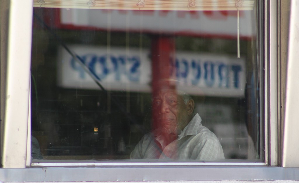 Morgan Freeman shooting a scene in the window booth at Nat's Diner 