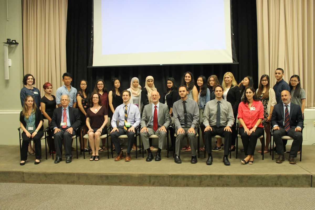 Teens who created the winning projects stand behind mental health care professionals who guided them.