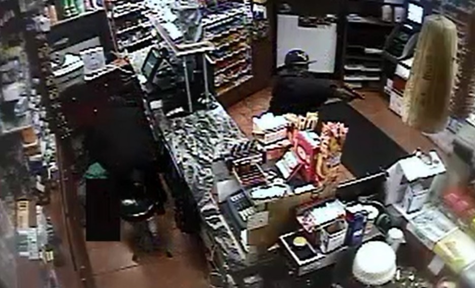 A 2-minute security camera video shows Sunday night's armed robbery at a Maspeth grocery store.
