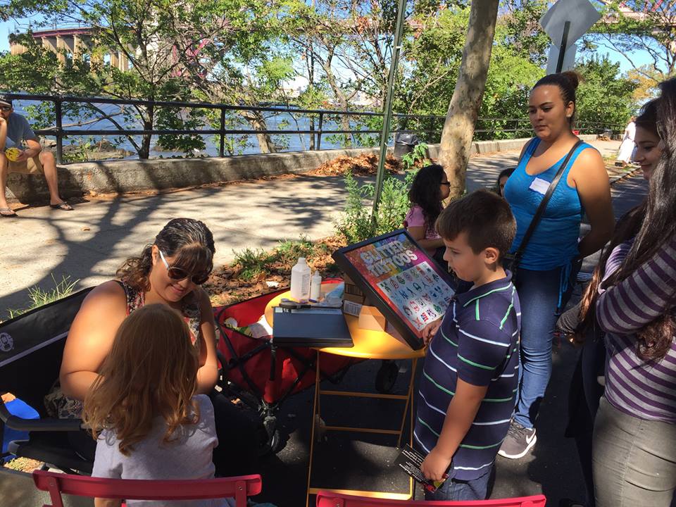 Children waiting in line to receive glitter tattoos at the Astoria Park Alliance Shorefest on Sept. 20.