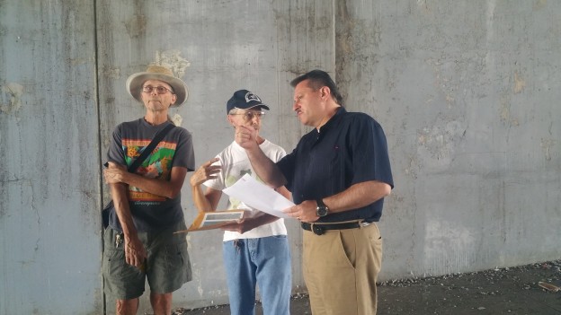 State Senator Joseph Addabbo (right) met with concerned residents, Richard Polgar (left) and Pete Sofio (center), to discuss the unsanitary conditions at an LIE underpass in Middle Village.
