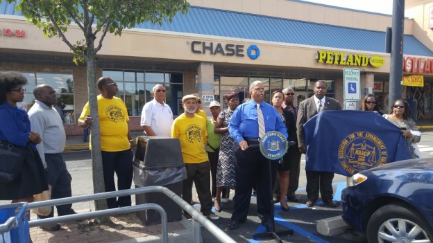 State Senator Leroy Comrie was joined by community members and local civic leaders to protest the closing of the Chase Bank branch at 134-40 Springfield Blvd.