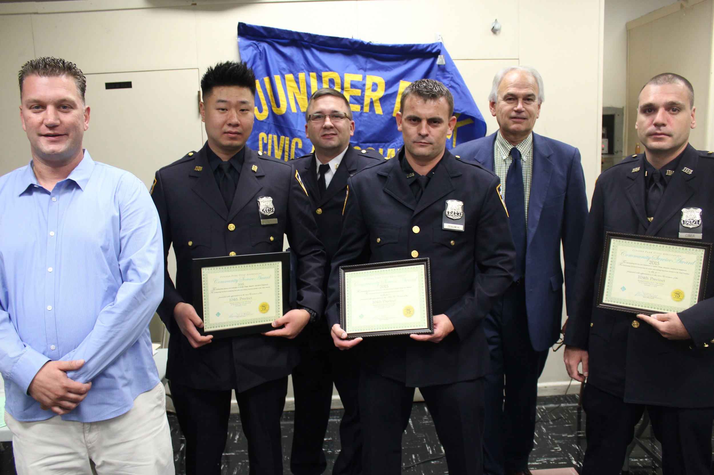 (l to r) Resident Brian McGoldrick , Officer Jonathan Ku, Captain Mark Wachter, Officer Onur Cumur and Officer Radoslaw Zbikowski were honored by JPCA President Robert Holden for their arrest of car thieves in Middle Village in August.