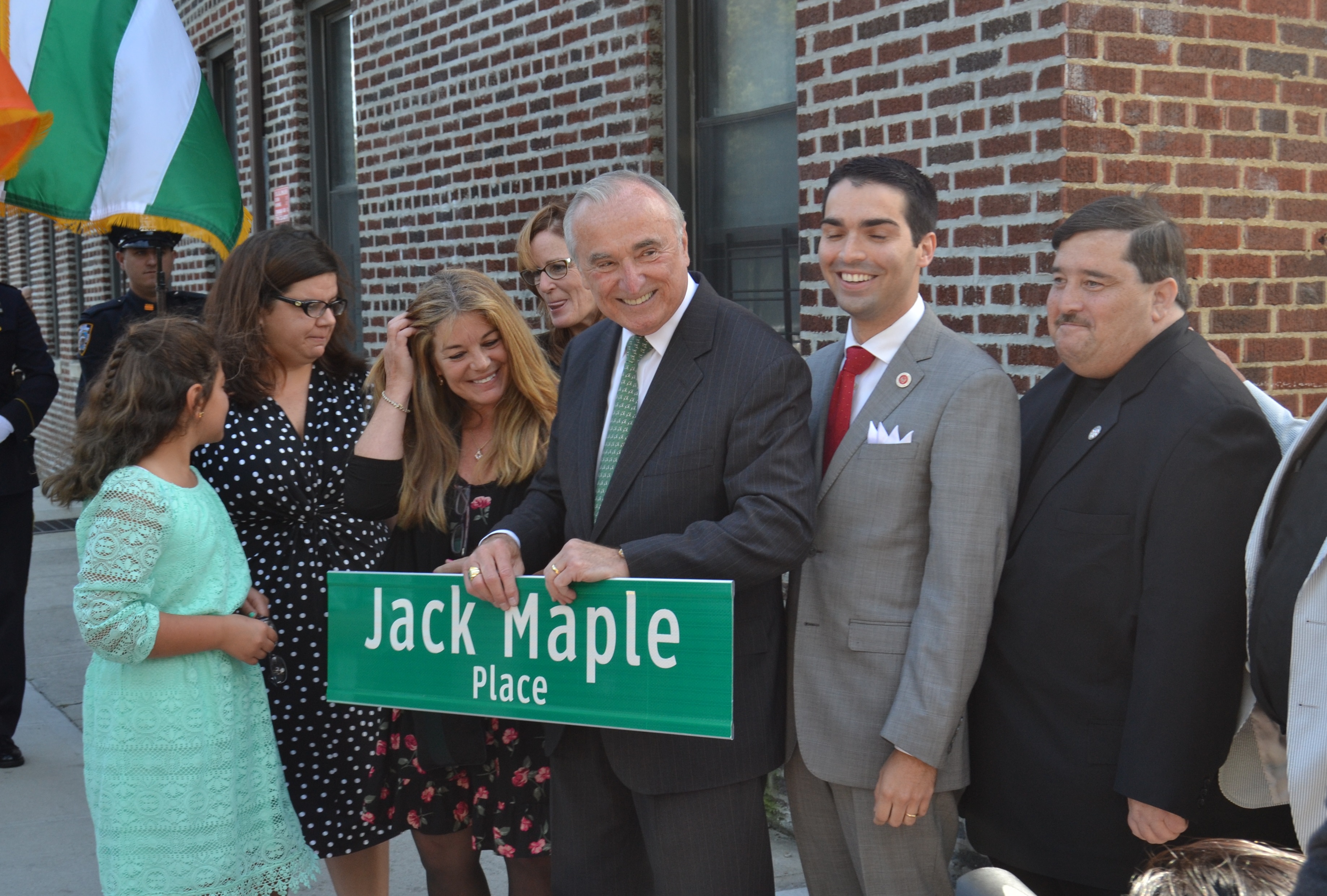 Members of Jack Maple's family (left) along with NYPD Commissioner Bill Bratton (center), Councilman Eric Ulric and Assemblyman Mike Miller present Jack Maple Way.