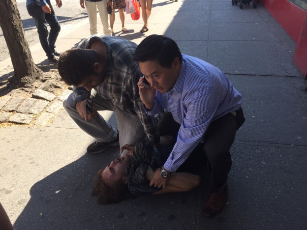 Assemblyman Ron Kim and a good Samaritan hold a would-be purse-snatcher until police arrive.