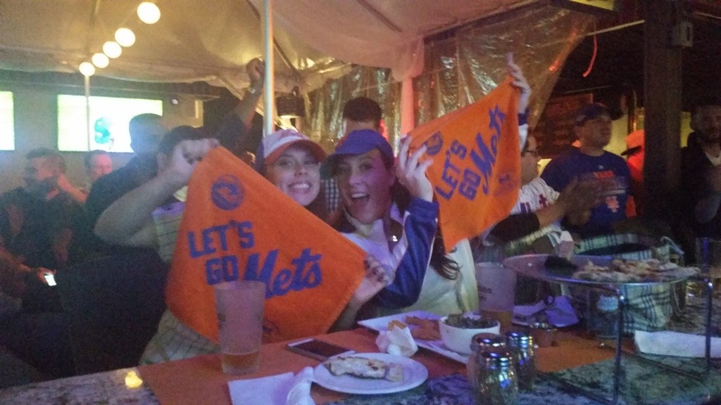 Fans celebrating the Mets making it into the World Series at Bourbon Street on Bell Boulevard in Bayside.
