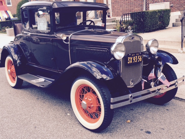 A celebration of the 100th anniversary of a Douglaston church included classic cars.