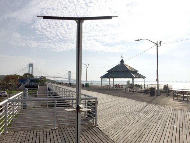Charging stations in public parks, similar to this one, are part of the ways AT&T is expanding its services and outreach in Queens.